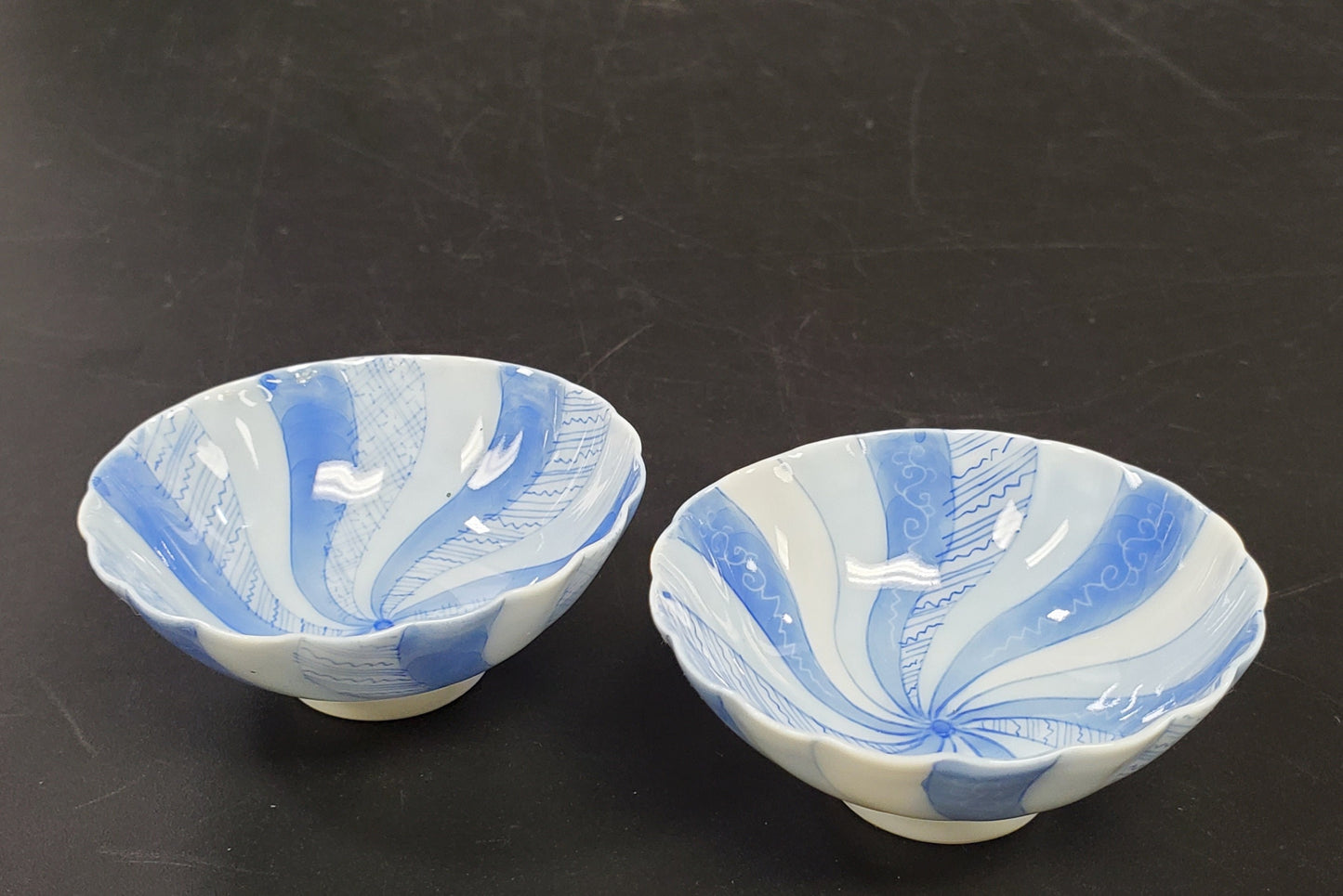 Fine Porcelain Pair of Spice Bowls or Salt Cellars in a Blue Swirl and Small Footer