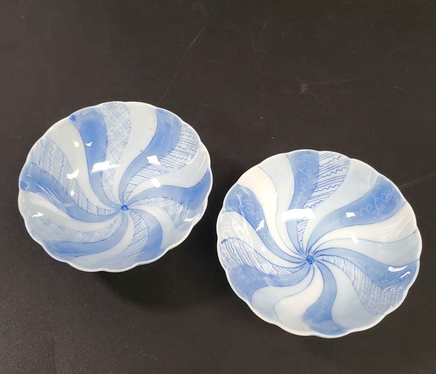 Fine Porcelain Pair of Spice Bowls or Salt Cellars in a Blue Swirl and Small Footer