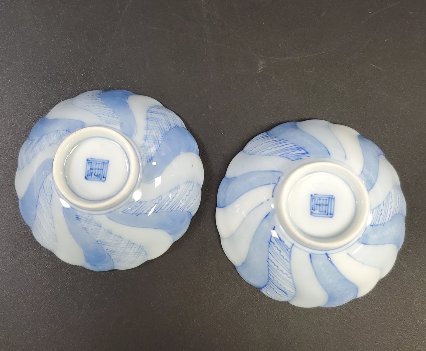 Fine Porcelain Pair of Spice Bowls or Salt Cellars in a Blue Swirl and Small Footer